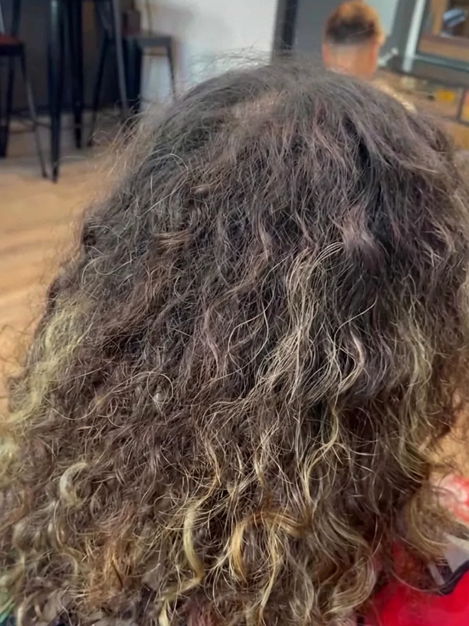 Before: dry, undefined curls with no shape and faded ends.