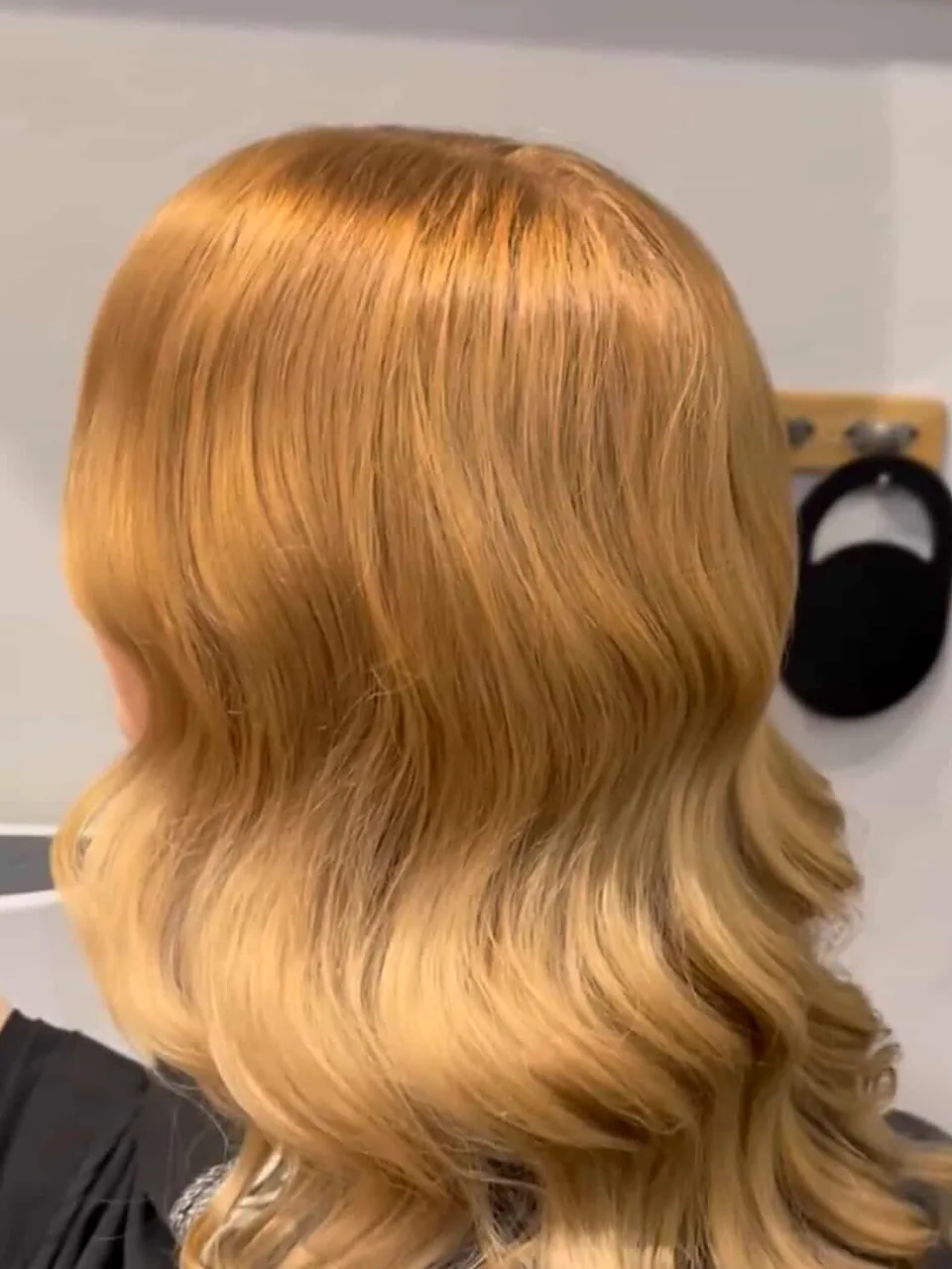 After: deep, polished Hollywood waves with a glassy finish.