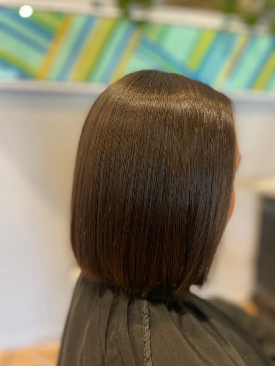 A sharp blunt bob cut to jaw length.